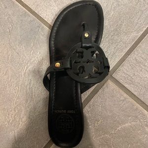 One Tory Burch Miller flip flop-left foot.